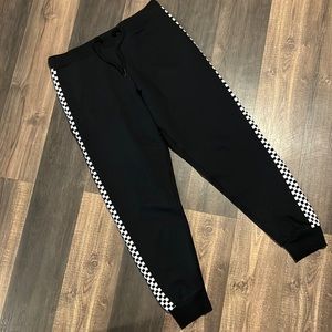 Vans Black Joggers with Vans Logo stripes on sides. Size M